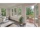 Bright dining room with large windows and access to the outdoor deck at 1007 Belle Ave, Roswell, GA 30076