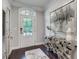 Bright foyer with modern artwork, unique decor, and hardwood flooring at 1007 Belle Ave, Roswell, GA 30076