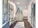 Welcoming foyer with elegant decor, staircase, and hardwood flooring at 1007 Belle Ave, Roswell, GA 30076
