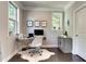 Cozy home office featuring a comfortable desk setup and natural light at 1007 Belle Ave, Roswell, GA 30076