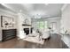 Bright living room with modern decor, fireplace, hardwood floors, and stylish furniture at 1007 Belle Ave, Roswell, GA 30076