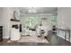 Well-lit living room showcasing a fireplace, elegant seating, and a view to the home office at 1007 Belle Ave, Roswell, GA 30076