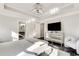 This main bedroom features a tray ceiling with a modern chandelier and a mirrored dresser at 1007 Belle Ave, Roswell, GA 30076