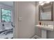 Bright powder room, conveniently located adjacent to the home office at 1007 Belle Ave, Roswell, GA 30076