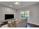 Comfortable sitting room with a large window and plush seating at 1007 Belle Ave, Roswell, GA 30076