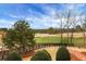 Expansive backyard view showcasing lush greenery, mature trees, and a serene golf course backdrop at 3123 Neal Ct, Cumming, GA 30041