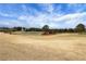 Expansive backyard view with a serene pond and well-manicured grounds at 3123 Neal Ct, Cumming, GA 30041