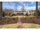 Beautiful community courtyard with manicured landscaping and park benches at 3123 Neal Ct, Cumming, GA 30041