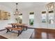 Bright dining area with hardwood floors, windows, and decorative lighting, perfect for Gathering meals and entertaining at 3123 Neal Ct, Cumming, GA 30041