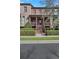 Charming brick townhouse featuring a welcoming front porch and meticulously landscaped yard at 3123 Neal Ct, Cumming, GA 30041