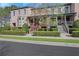 Brick townhomes featuring manicured landscaping, inviting front porches, and a well-maintained facade at 3123 Neal Ct, Cumming, GA 30041