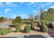 View of common green space featuring manicured bushes and a lovely meadow at 3123 Neal Ct, Cumming, GA 30041