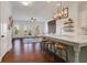 View from kitchen of living room with granite counters, pendant lights, and stainless appliances at 3123 Neal Ct, Cumming, GA 30041