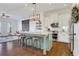 Open-concept kitchen boasts a large center island, modern appliances, and ample counter space for cooking and entertaining at 3123 Neal Ct, Cumming, GA 30041