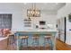 Well-equipped kitchen featuring a center island with bar seating, stainless steel appliances, and open layout for easy socializing at 3123 Neal Ct, Cumming, GA 30041