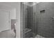 Modern bathroom with tiled shower and bench, and glass door at 3123 Neal Ct, Cumming, GA 30041