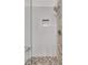 Modern shower with white subway tile and a pebble floor design at 3123 Neal Ct, Cumming, GA 30041
