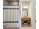 Cozy bathroom with a tiled floor, single vanity, and a shower with a striped curtain at 1430 Dresden Ne Dr # 200, Atlanta, GA 30319