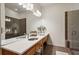 Modern bathroom featuring a double sink vanity, large mirror, and a glass-enclosed shower at 1430 Dresden Ne Dr # 200, Atlanta, GA 30319