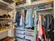 Well-organized walk-in closet with shelves and hanging rods, maximizing storage space at 1430 Dresden Ne Dr # 200, Atlanta, GA 30319