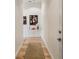 Hallway with hardwood flooring and modern artwork for a cozy and artistic entry to the home at 1430 Dresden Ne Dr # 200, Atlanta, GA 30319