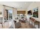 Inviting living room with a comfortable white sectional and large window with a balcony view at 1430 Dresden Ne Dr # 200, Atlanta, GA 30319