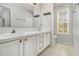 Bathroom with double vanity, tile countertops, and neutral color palette at 170 Double D Rd, Temple, GA 30179