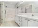 Bathroom with double vanity, shower-tub, and bright natural light at 170 Double D Rd, Temple, GA 30179