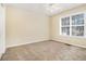 A cozy bedroom featuring a bright window and carpeted flooring at 170 Double D Rd, Temple, GA 30179