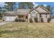 Charming ranch-style home with a manicured lawn, welcoming front porch, and attached two-car garage at 170 Double D Rd, Temple, GA 30179