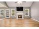 Cozy living room featuring hardwood floors, fireplace and natural light at 170 Double D Rd, Temple, GA 30179