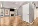 Spacious living room featuring vaulted ceilings, beautiful floors, fireplace, and natural light at 170 Double D Rd, Temple, GA 30179