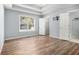 Spacious main bedroom with wood floors, tray ceiling, and ensuite bathroom at 170 Double D Rd, Temple, GA 30179