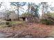 Overgrown lot with a shed at 2443 Highway 92 S, Fayetteville, GA 30215