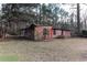 Rustic storage shed on an overgrown lot at 2443 Highway 92 S, Fayetteville, GA 30215