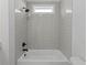 Bathroom featuring shower with neutral-colored tiling and black fixtures at 4190 Hosch Reserve Dr, Buford, GA 30519