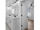 Bathroom featuring double sinks and modern fixtures and lighting at 4190 Hosch Reserve Dr, Buford, GA 30519