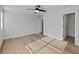 Bedroom features include luxury vinyl floors, white walls, ceiling fan and two closets at 4190 Hosch Reserve Dr, Buford, GA 30519