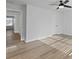 Bright, neutral bedroom with LVP flooring, ceiling fan and two doorways at 4190 Hosch Reserve Dr, Buford, GA 30519