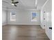 Spacious bedroom featuring a trey ceiling, ceiling fan, and bright light from two windows at 4190 Hosch Reserve Dr, Buford, GA 30519