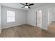 Bedroom features luxury vinyl floors, neutral paint, and a ceiling fan at 4190 Hosch Reserve Dr, Buford, GA 30519