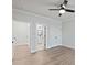 Bright bedroom featuring sleek ceiling fan, and light hardwood flooring at 4190 Hosch Reserve Dr, Buford, GA 30519