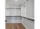 Spacious walk-in closet with custom shelving and hanging rods, offering ample storage at 4190 Hosch Reserve Dr, Buford, GA 30519