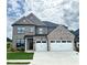 Beautiful two story home features a two-car garage and a well-manicured lawn at 4190 Hosch Reserve Dr, Buford, GA 30519