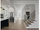 Hallway and kitchen with stairs leading to the second floor at 4190 Hosch Reserve Dr, Buford, GA 30519