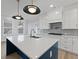 Modern kitchen with stainless appliances, white countertops and a large center island at 4190 Hosch Reserve Dr, Buford, GA 30519