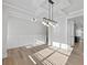 Open-concept living space with hardwood floors, recessed lighting, and seamless flow to the kitchen area at 4190 Hosch Reserve Dr, Buford, GA 30519