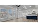 Open-concept living area with hardwood floors, lots of windows and kitchen view at 4190 Hosch Reserve Dr, Buford, GA 30519