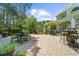 Paver patio with multiple seating areas and views of lush, private landscaping at 4635 High Point Rd, Atlanta, GA 30342
