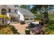 Outdoor living area featuring a fireplace and patio with a built-in grill and bar, with 2 car garage at 4635 High Point Rd, Atlanta, GA 30342
